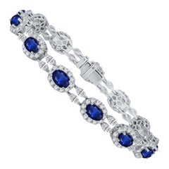 Used 9.42 Carat Vivid Blue Oval Cut Sapphire and 3.94 Carat Diamond Bracelet ref363
