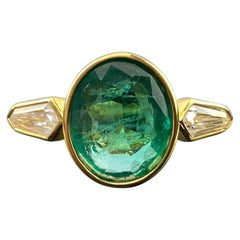 Vintage 2.6 Carat Oval Shape Emerald and Diamond Three Stone Engagement Ring