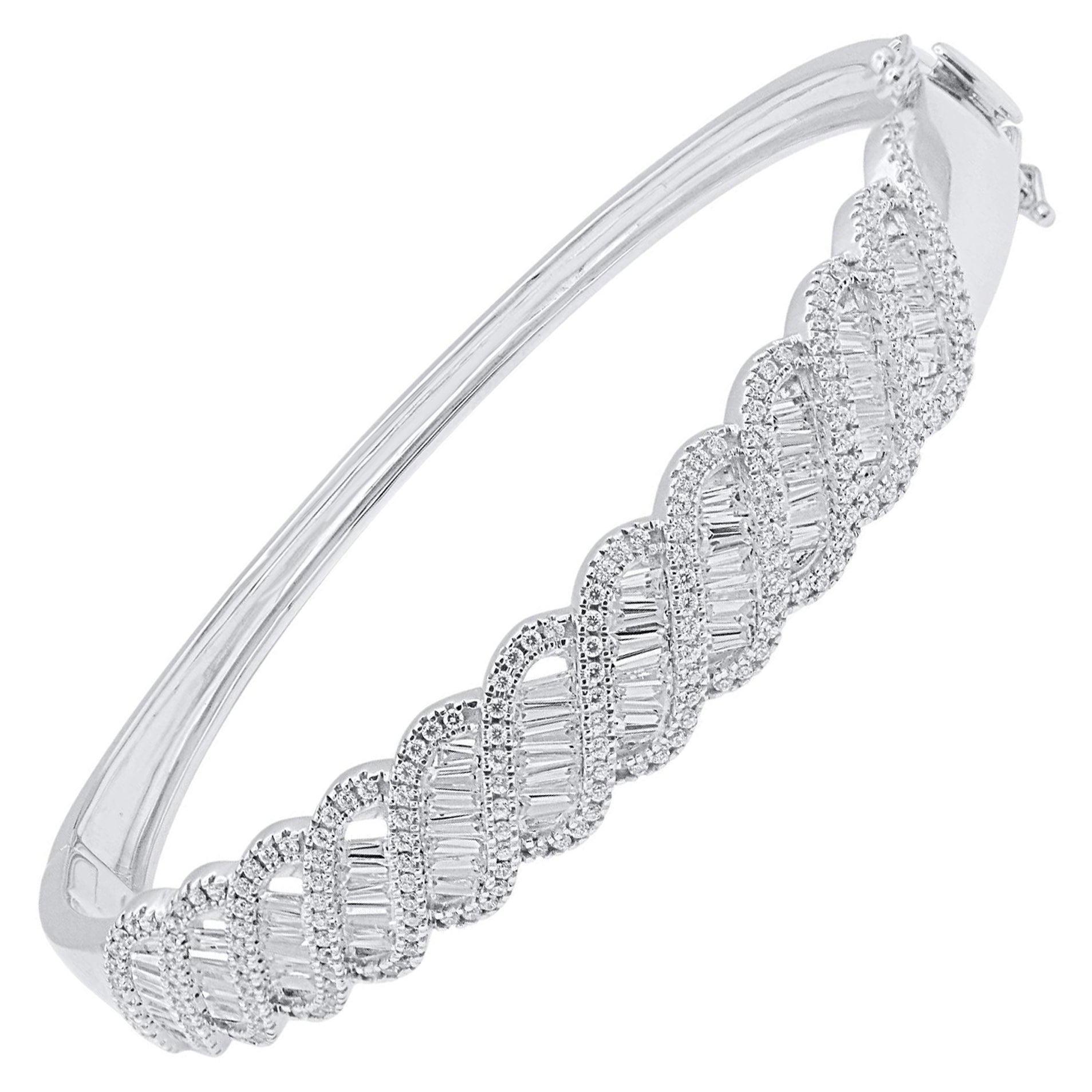 Classic and sophisticated, this diamond bangle bracelet pairs well with any attire.
This Shimmering bangle features 267 natural single cut & baguette diamonds in prong and Channel setting and crafted in 14 kt white gold. Diamonds are graded H-I