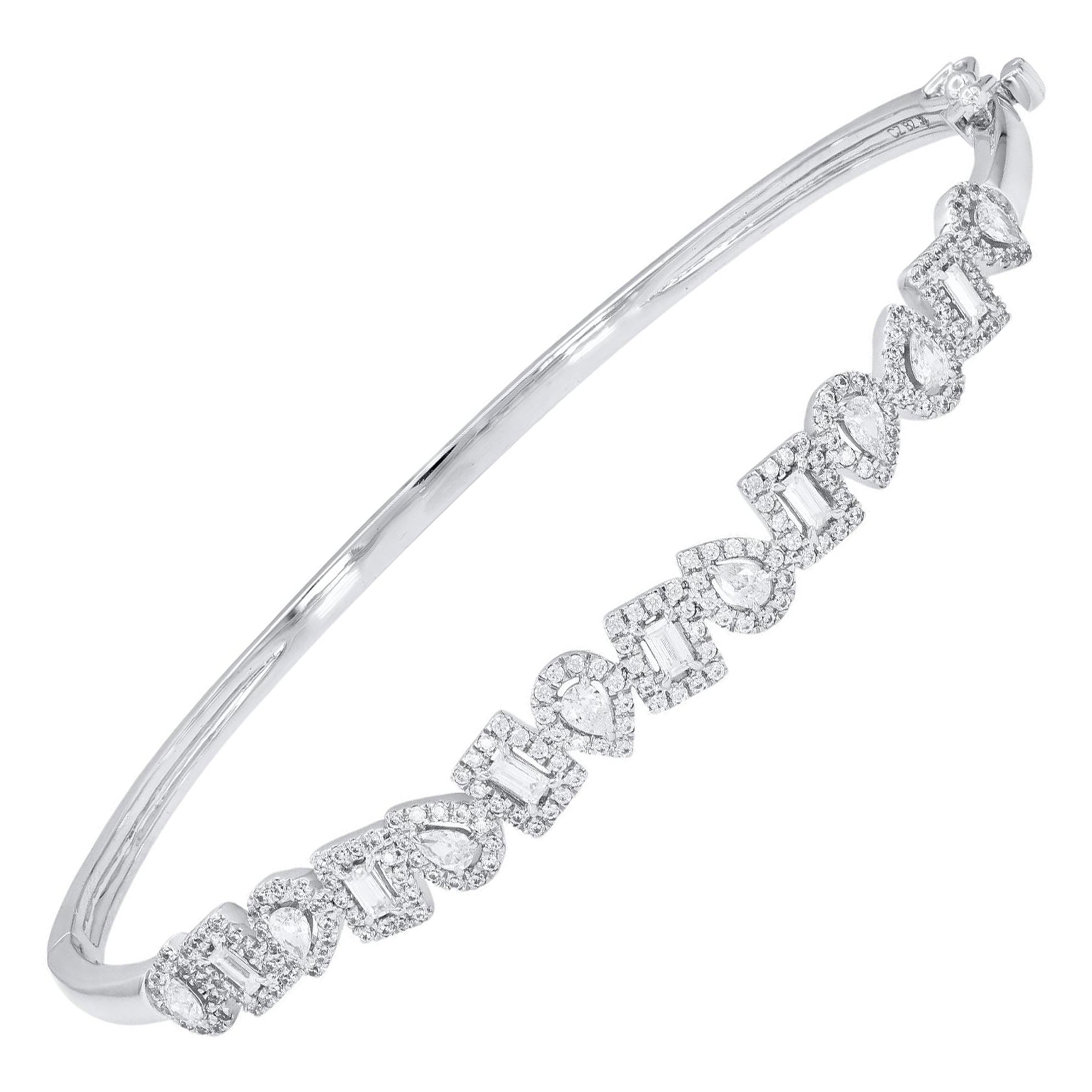 Classic and sophisticated, this diamond bangle bracelet pairs well with any attire.
This Shimmering bangle bracelet features 194 natural pear, baguette & single cut diamonds in prong setting and crafted in 14 kt white gold. Diamonds are graded H-I
