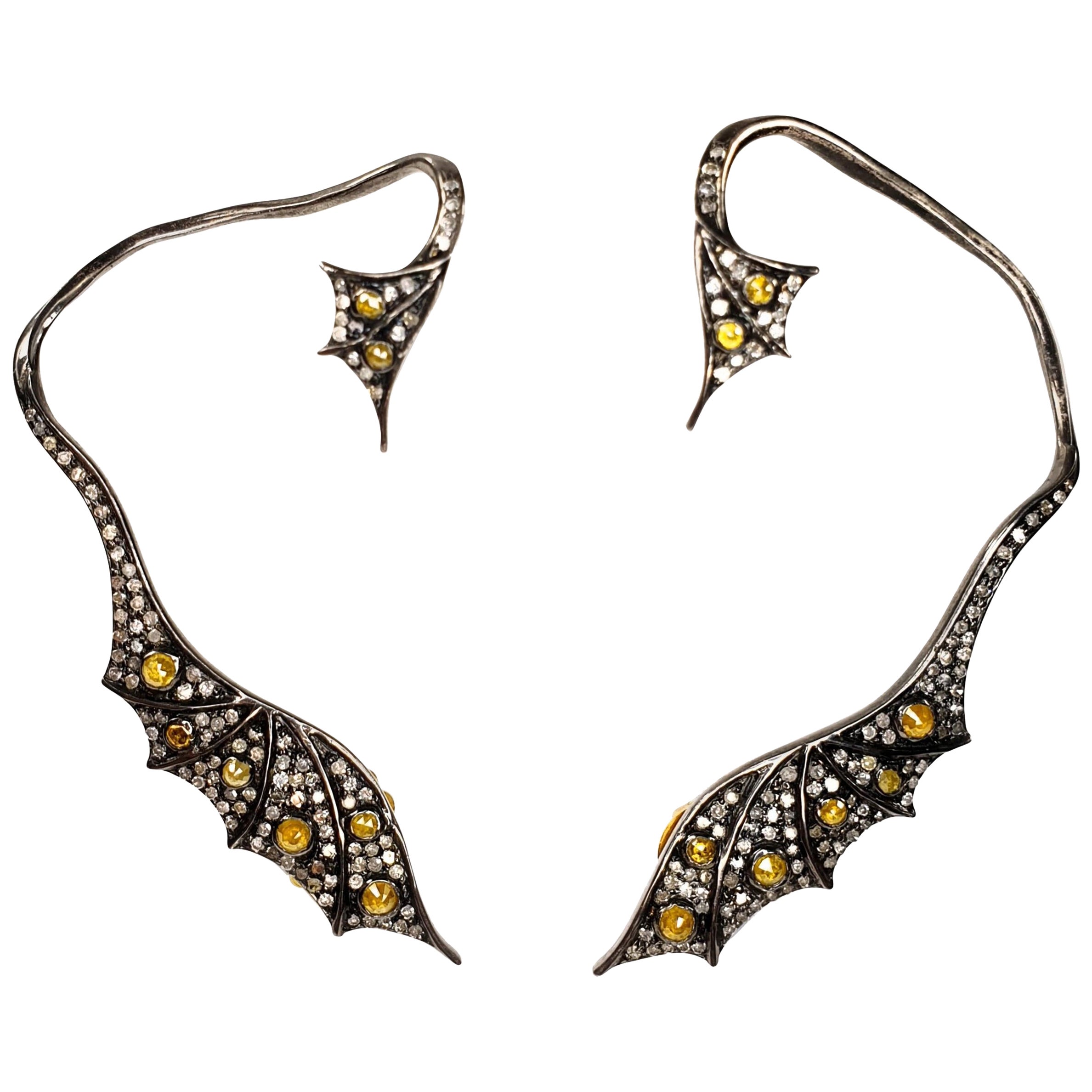 18 Karat Gold and Silver Dragon Cuff Earrings with Diamonds and Yellow Saphires