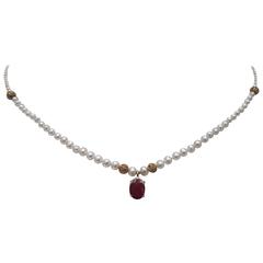 Petite Graduated Pearl necklace with 14 K Gold, and Faceted Ruby Stone Pendant