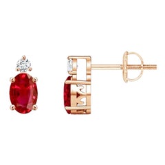 ANGARA Natural Oval 0.50ct Ruby Stud Earrings with Diamond in 14K Rose Gold