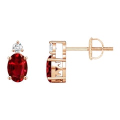 ANGARA Natural Oval 0.50ct Ruby Stud Earrings with Diamond in 14K Rose Gold