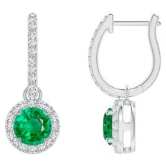 Orecchini con smeraldo rotondo Nature e diamante aureolato in platino (misura 5 mm)