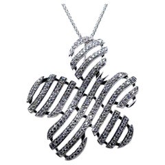 P138 - 18K WHITE GOLD FLOWER PENDANT with 16” CHAIN