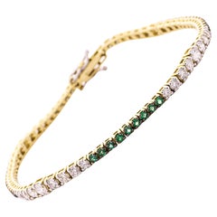  Alex Jona: 18 Karat Gelbgold-Tennisarmband mit Smaragd und weißen Diamanten