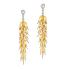 Boucles d'oreilles pendantes en or jaune et diamants