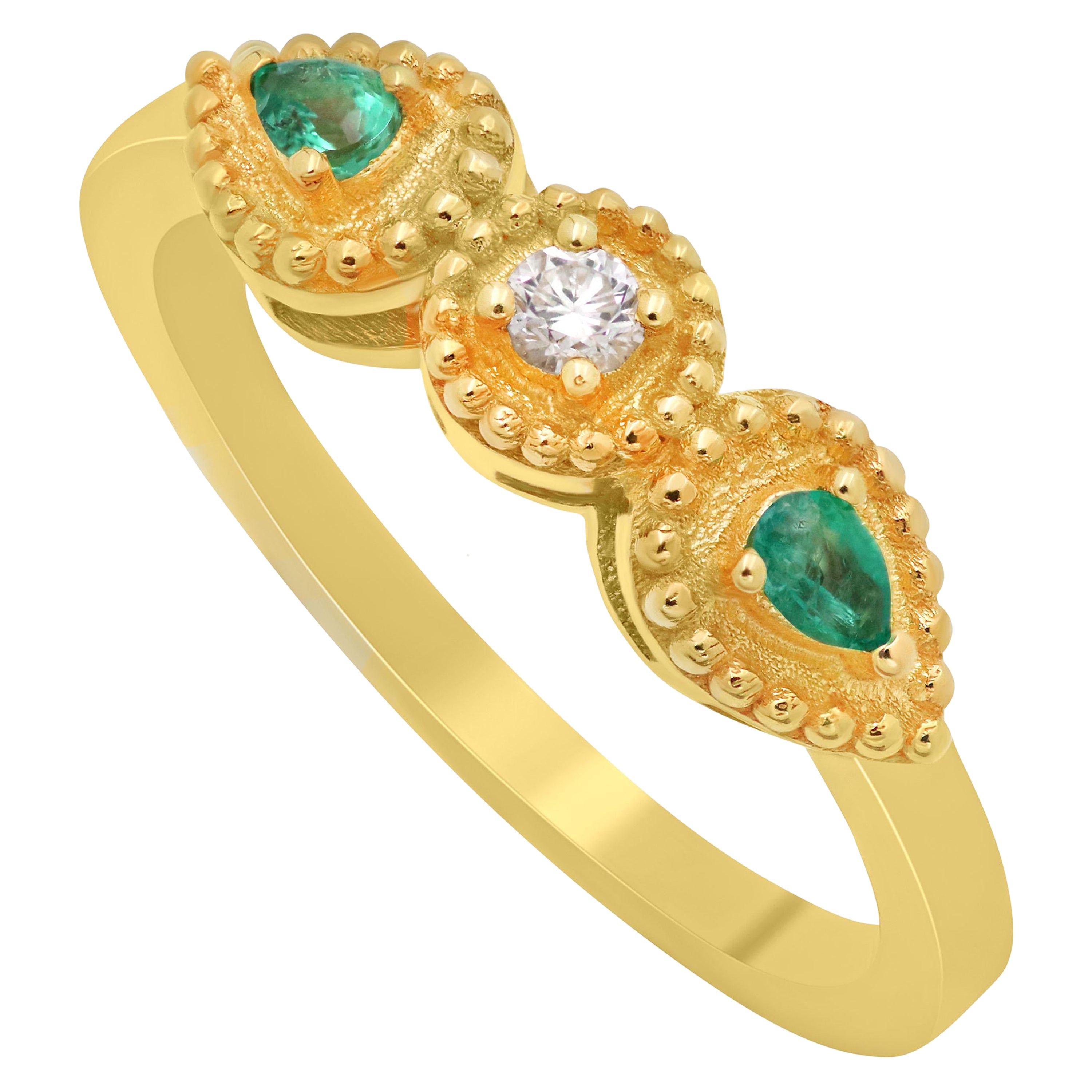 Dimos 18k Gold Balance Ring with Emeralds and Diamond For Sale