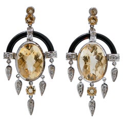 Topazs, Onyx, Diamonds, Platinum Dangle Earrings.