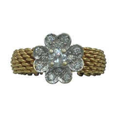 Tiffany & Co 18 karat gold Somerset mesh ring with a diamond flower