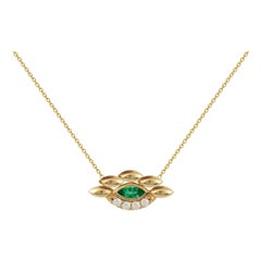 Eye Pendant in 18 Karat Yellow Gold With Diamonds And An Emerald