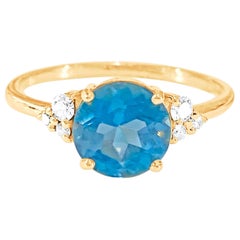 Bague aigue-marine ronde et diamants en or jaune 18 carats