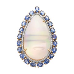 Anillo de oro amarillo de 18 quilates con ópalo etíope en forma de pera, zafiro azul y diamantes