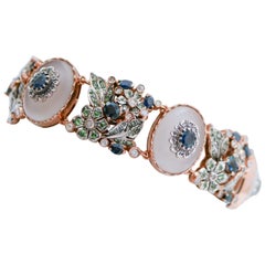 Opale, cristal de roche, tsavorite, saphirs, diamants, bracelet en or et en argent.