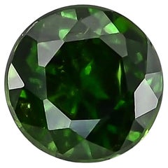 0.77 Carats Russian Demantoid Garnet with 'horse tail' inclusions 