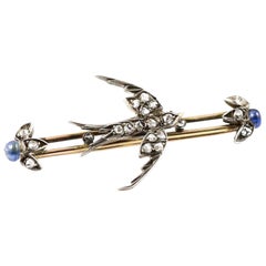 Victorian Sterling Silver and 10k Gold Swallow Brooch with Diamonds and Sapphire