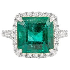 Alexander GIA certified 5.21 Carat Emerald with Diamond Halo Ring 18 Karat Gold
