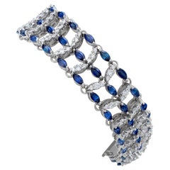 Marquise cut sapphires and round brilliant diamonds bracelet set in white gold.