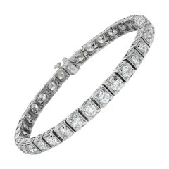 Vintage Platinum diamond bracelet w/ round brilliant cut diamonds set in 4 prong setting