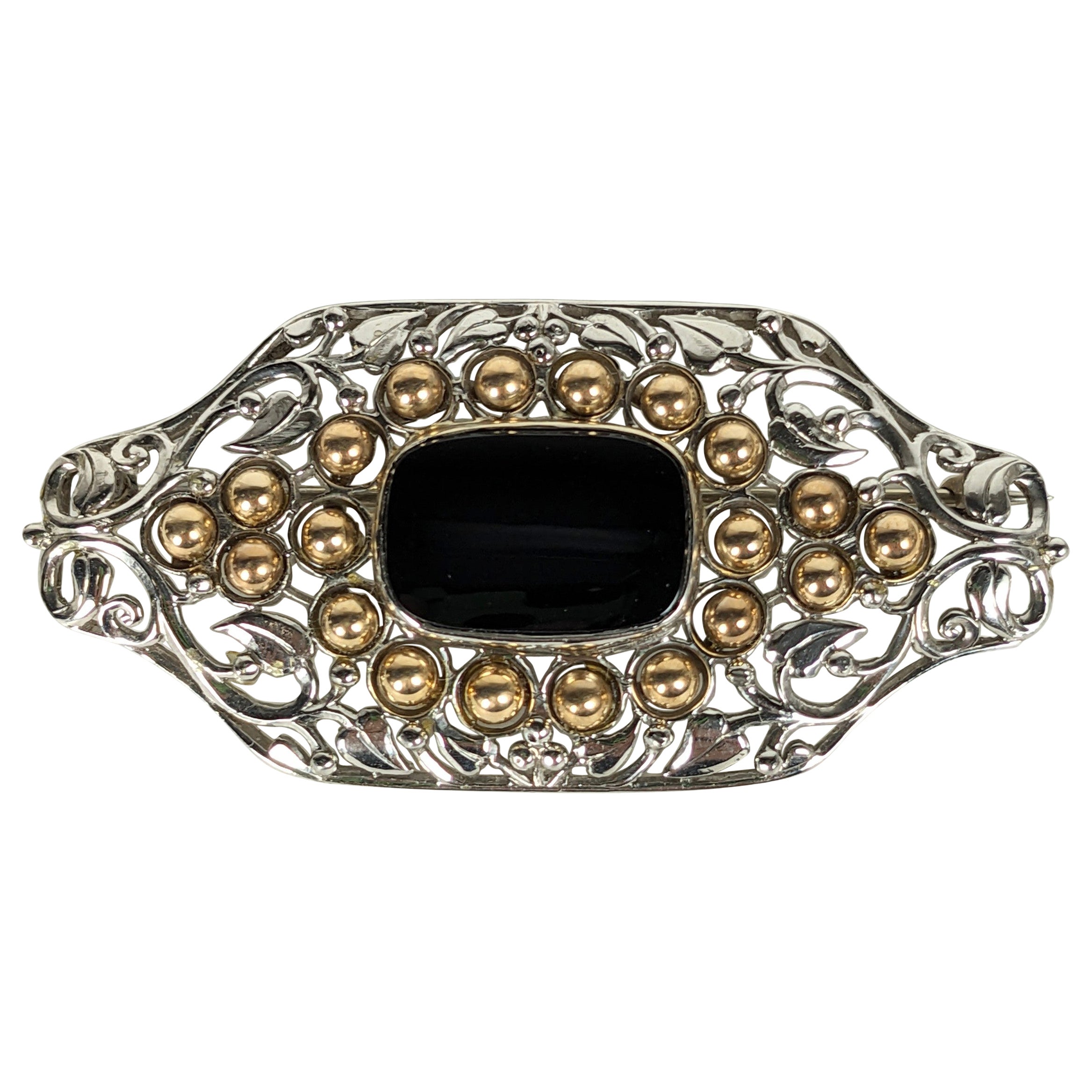 Unusual Arts and Crafts Platinum, Gold and Onyx Brooch, F.G. Hale