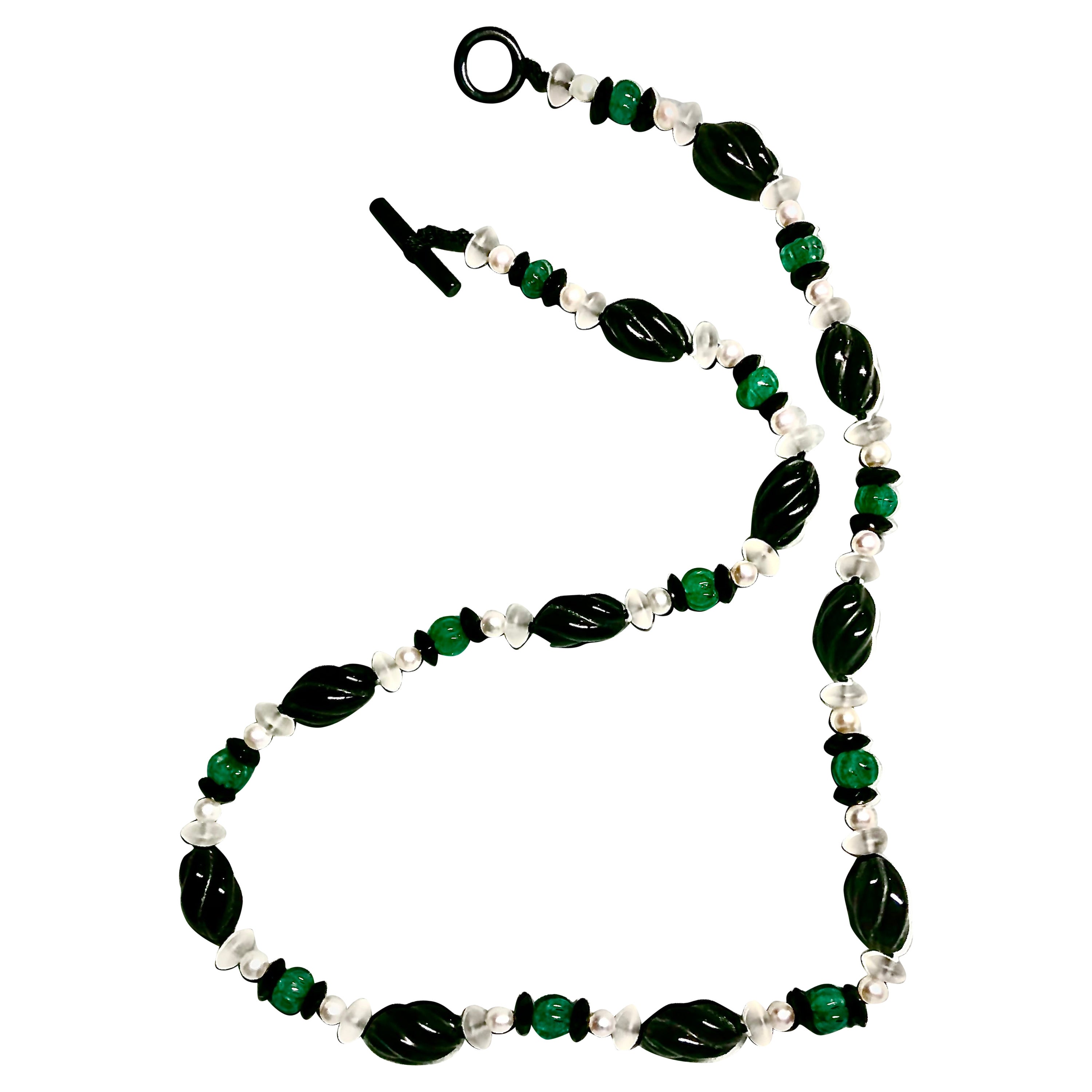 Very elegant long necklace of vintage hand carved torchon black onyx beads. These are extremely rare to find, and I basically source them from antique stock.

These beautiful onyx beads are flanked with frosted rock crystal smooth rondelles. These
