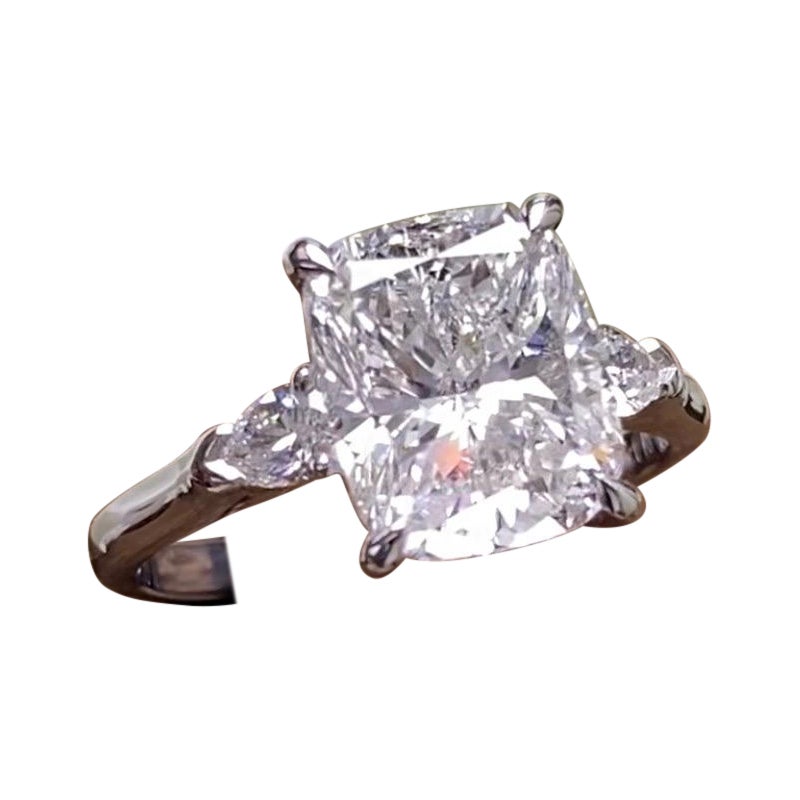 A MORCHA 3ct Cushion Diamond Ring set with 2 Pear shape side diamonds.GIA For Sale