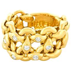 Hermes Bague flexible en or jaune et diamants