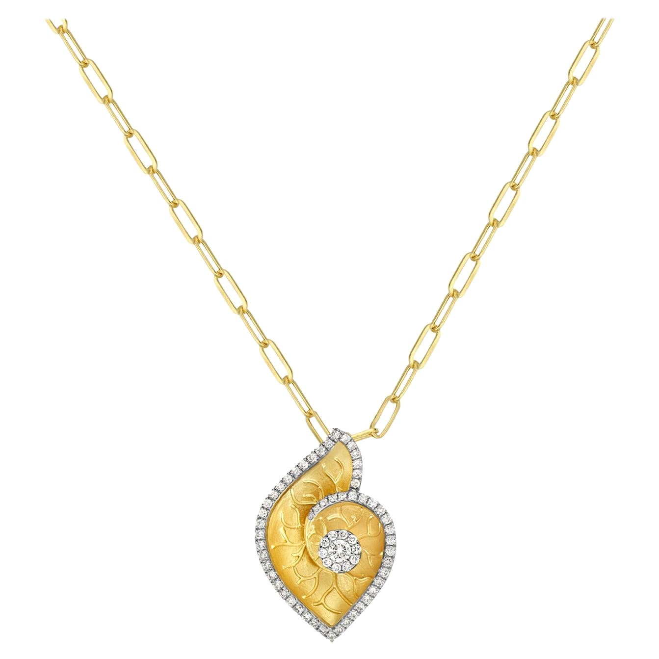 Shell Shaped Carved Pendant in 14k Yellow Gold Bordered with Pave Diamonds For Sale