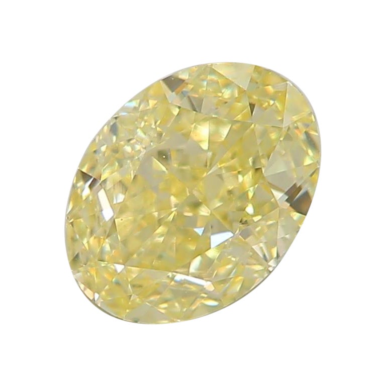 0.63 Carat Fancy Light Yellow Oval Cut Diamond VS2 Clarity GIA Certified For Sale