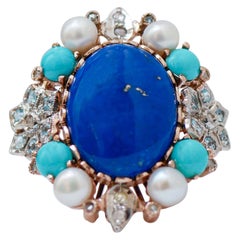 Topacio color aguamarina, lapislázuli, turquesa, diamantes, perla Anillo de oro y plata 