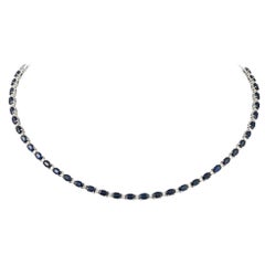 Collier fantaisie de 16 000 $ en or 18 carats avec grand saphir bleu pailleté et diamants