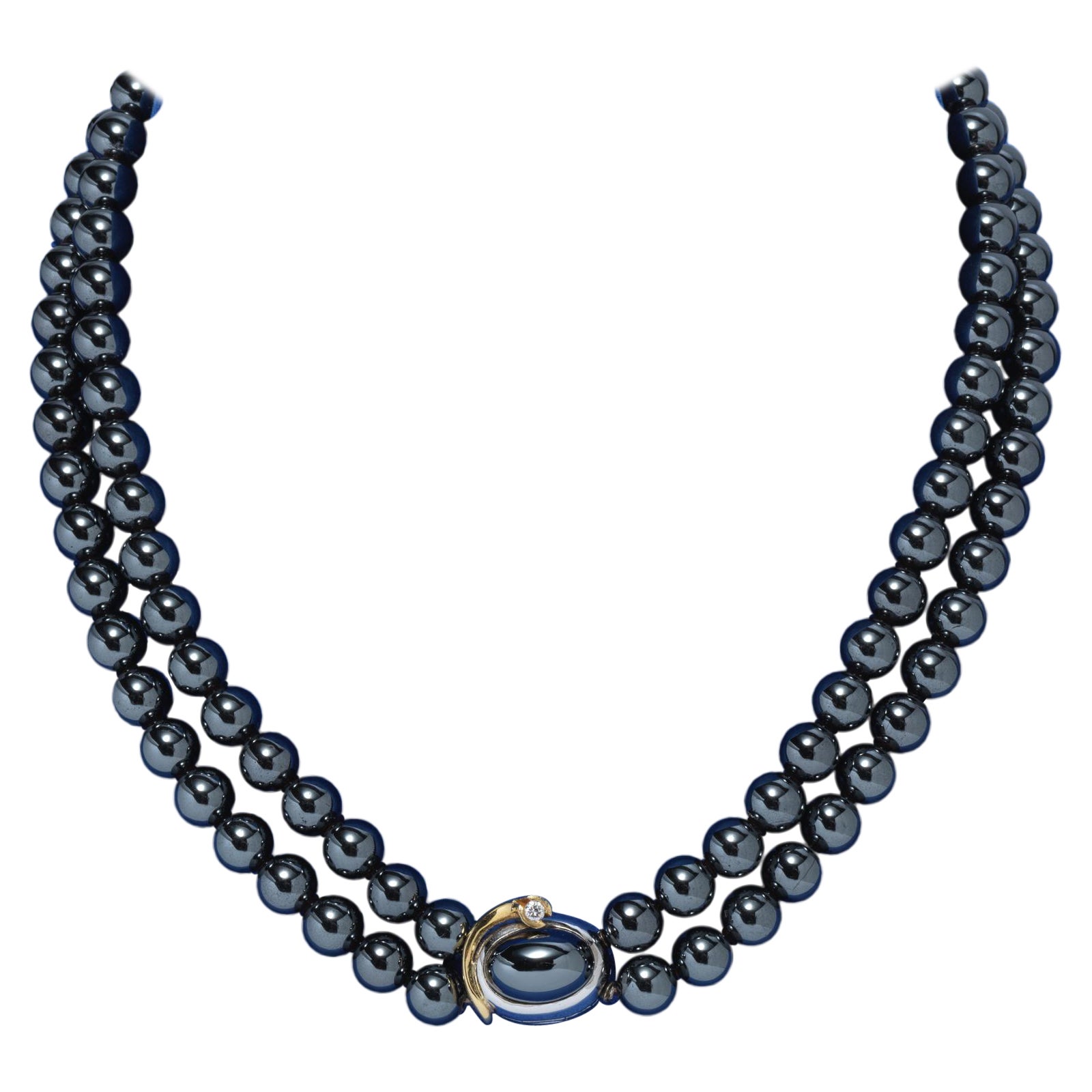 Ole Lynggaard necklace with hematite beads. Lock made of gold with a diamond. For Sale
