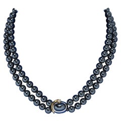 Used Ole Lynggaard necklace with hematite beads. Lock made of gold with a diamond.