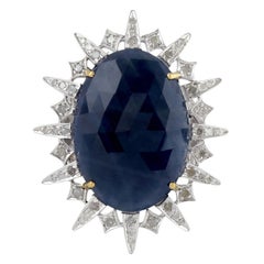 Oval Shape Blue Sapphire Ring Set in Sun Motif with Diamonds in Gold and Silver