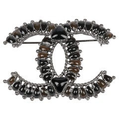 Chanel Glass Aged Ruthenium Tone CC Logo Brooch