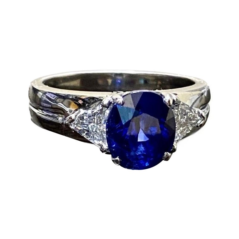 Platinum Three Stone Trillion Diamond 4.10 Carat Blue Sapphire Engagement Ring For Sale