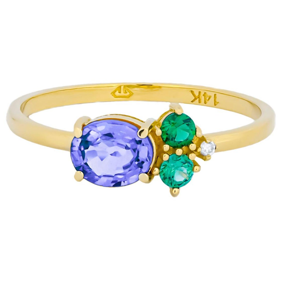 Ovaler Ring aus Tansanit, Tsavorit und Diamanten aus 14 Karat Gold.
