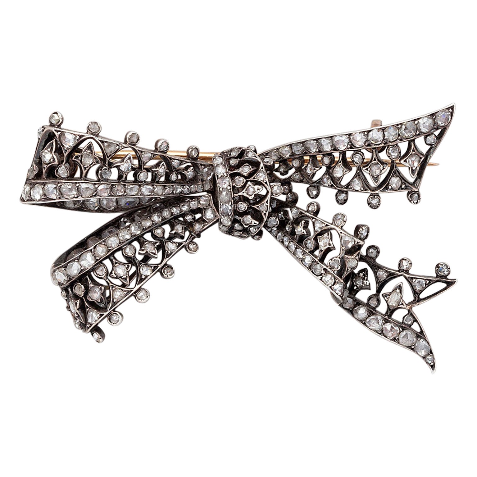 A Silver and Gold Antique Bow Brooch set with Diamonds For Sale