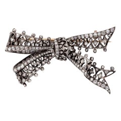 A Silver and Gold Antique Bow Brooch set with Diamonds
