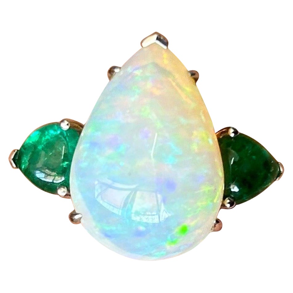 11.36 Carat Pear Shape Opal and Emerald Three Stone Cocktail Ring For Sale