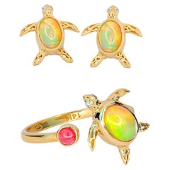 Turtle set: earrings studs and ring with opals in 14k gold.