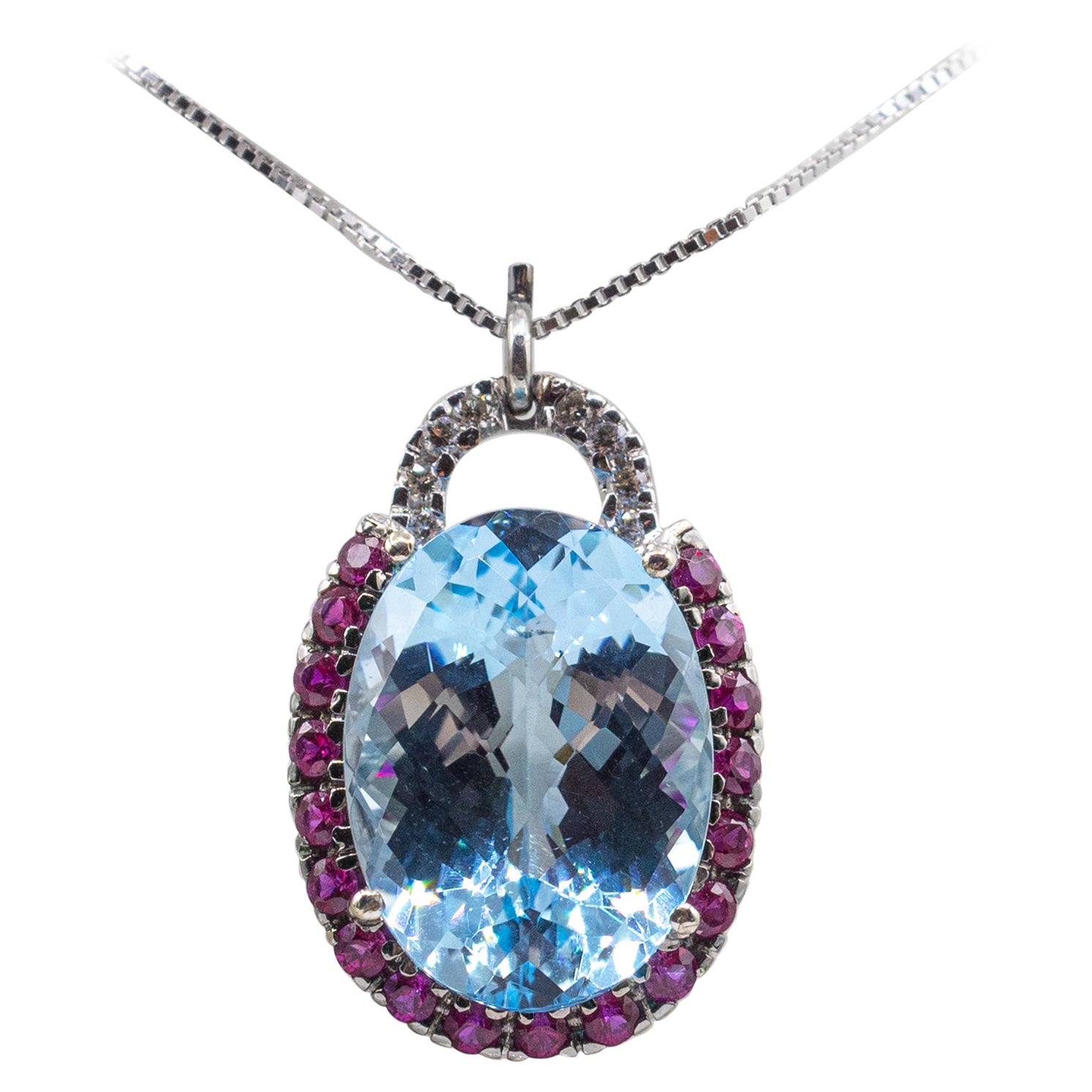 Art Deco White Diamond Ruby Oval Cut Blue Topaz White Gold Pendant Necklace For Sale