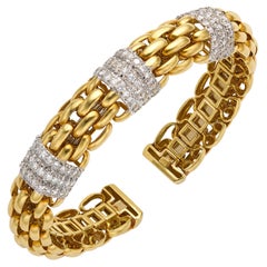Bracelet manchette à maillons tissés en or jaune 18k et diamants