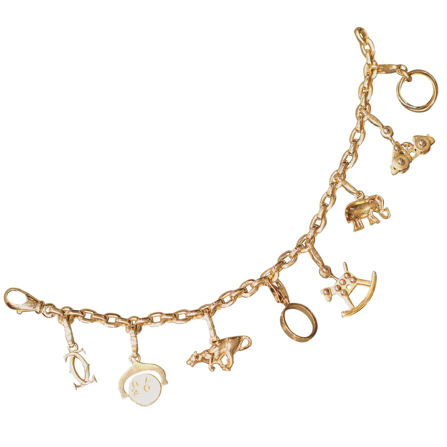 CARTIER Gold 8 Charm Bracelet For Sale at 1stdibs