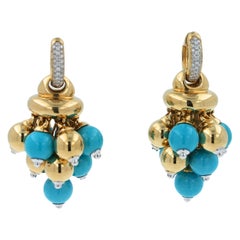 Blue Turquoise Diamonds Golden Sphere Bells Motif Two Tone Gold Huggie Earrings