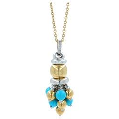 Blue Turquoise Diamonds Golden Sphere Bells Motif Two Tone Gold Pendant Necklace