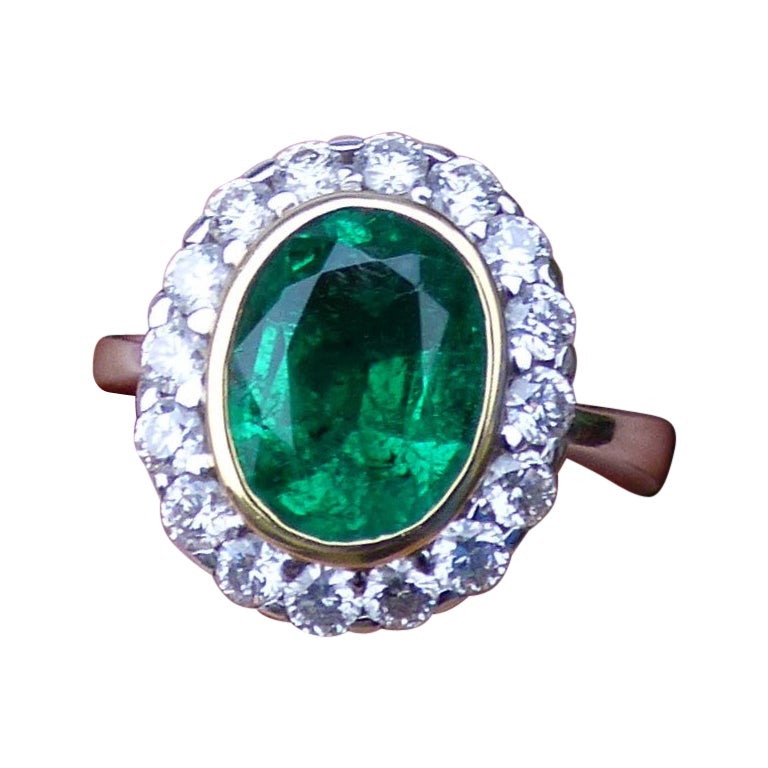 2.37ct. Oval Emerald and Diamond Ring in 18K Gold For Sale