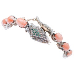 Coralli, smeraldi, tsavorite, diamanti, bracciale a serpente in oro rosa e argento