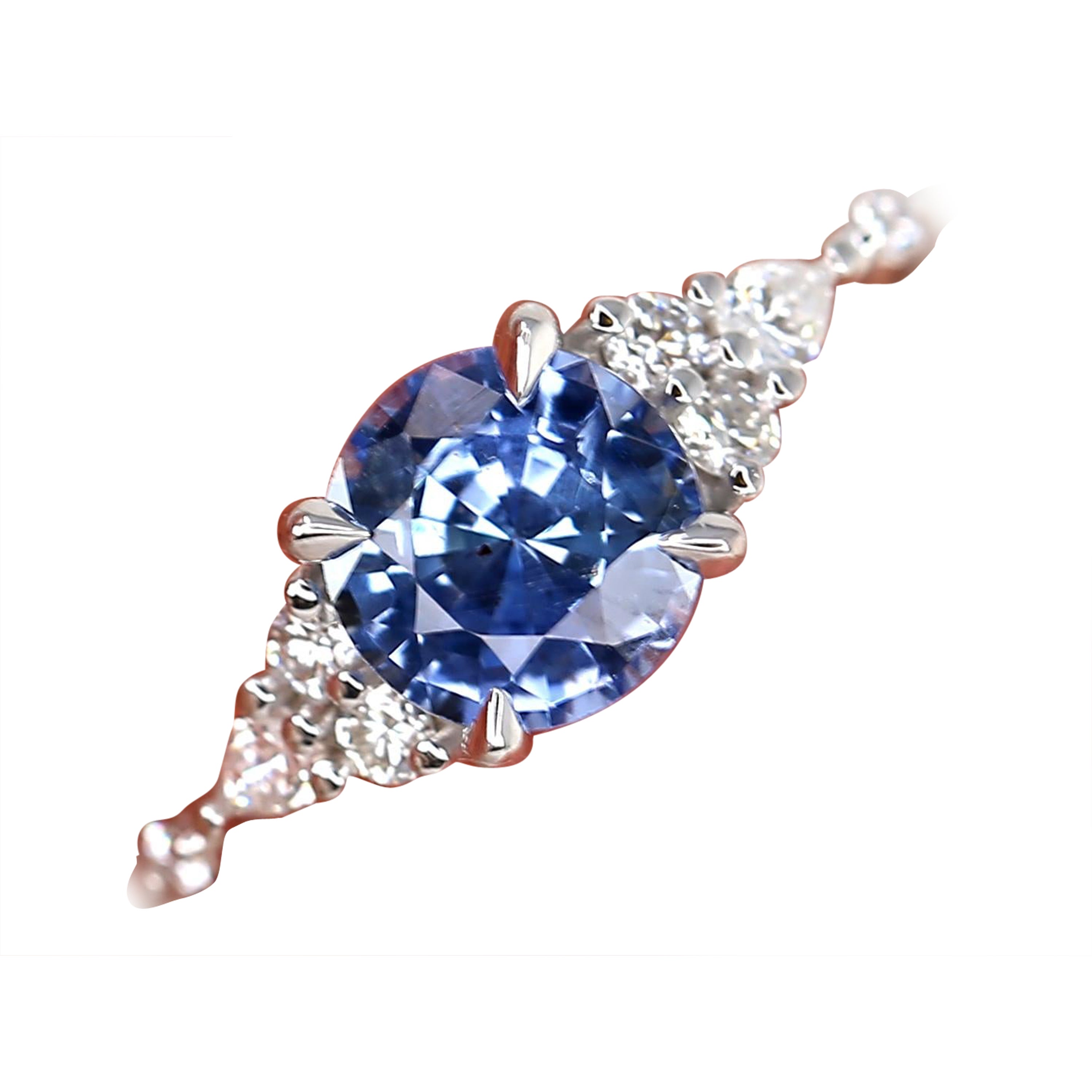 Add a touch of whimsy to your jewelry collection with our Anastasia ring. This 14kt white gold piece features a rare cornflower sapphire surrounded by dazzling diamonds, creating a dreamy cluster design. Perfect for any special occasion or as a